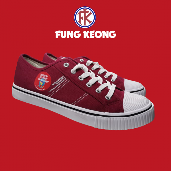 A maroon coloured low cut sneakers with a Fung Keong logo above it.